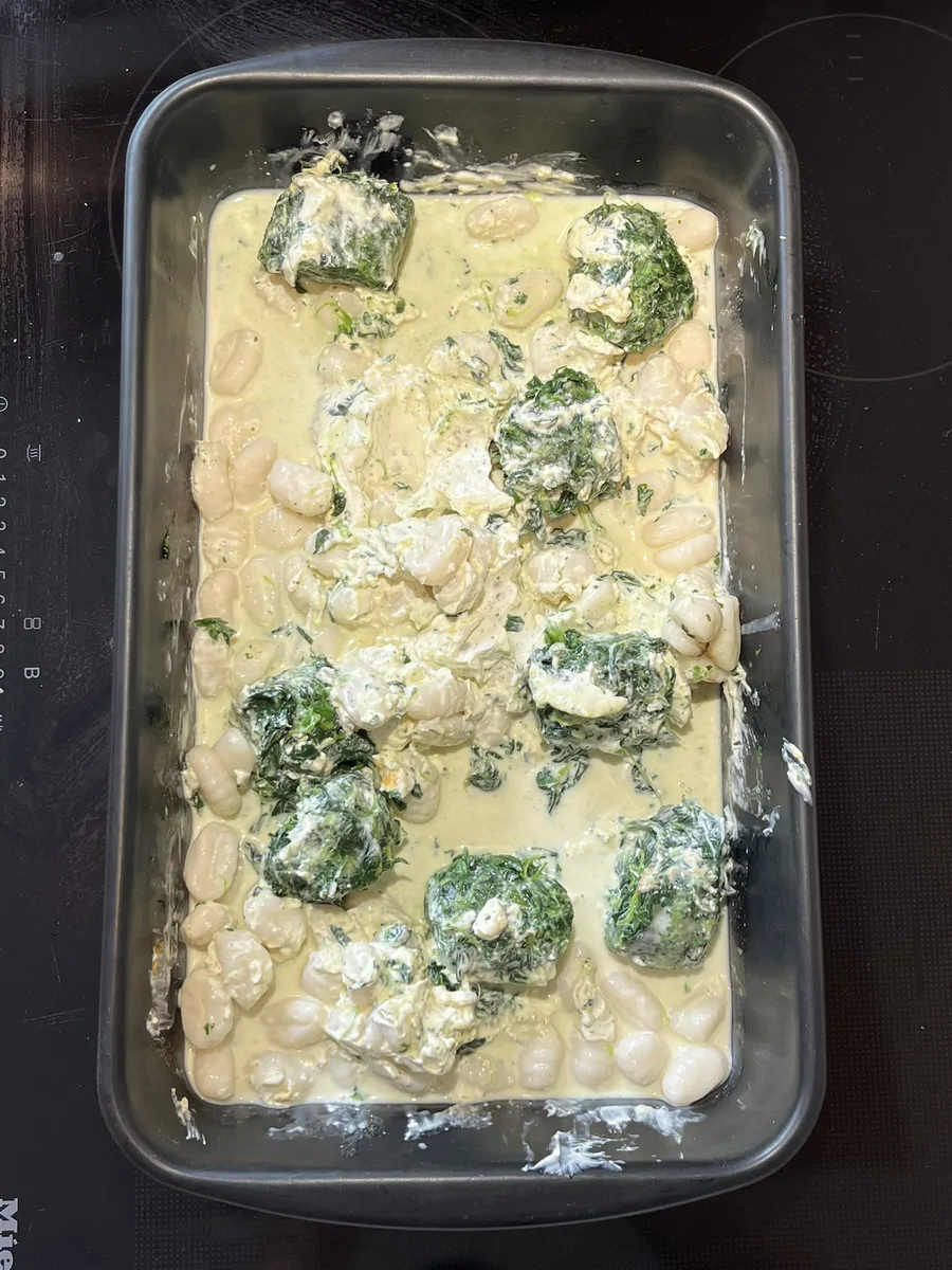 Ingredients assembled before baking; stirring at the midpoint before the cheese topping